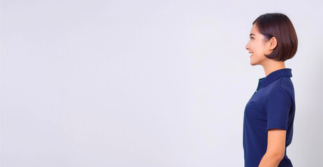 A side profile of an Asian woman wearing a navy blue polo shirt.