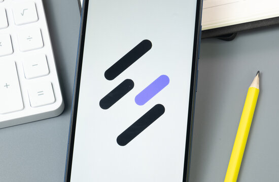 New York, USA - 30 August 2024: suterusu SUTER Logo on Phone Screen, Crypto Icon on Display