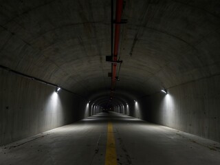 Completed tunnel with smooth concrete walls stretching into darkness.
