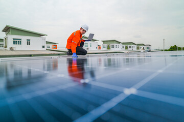 engineer man inspects construction of solar cell panel or photovoltaic cell by electronic device....