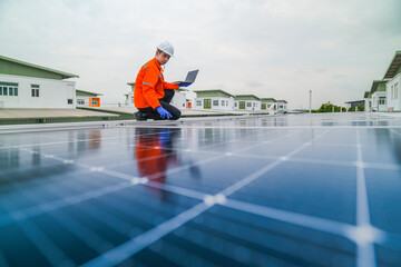 engineer man inspects construction of solar cell panel or photovoltaic cell by electronic device....