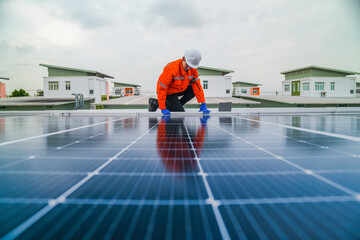 engineer man inspects construction of solar cell panel or photovoltaic cell by electronic device....