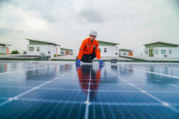 engineer man inspects construction of solar cell panel or photovoltaic cell by electronic device. Industrial Renewable energy of green power. factory worker working on tower roof.