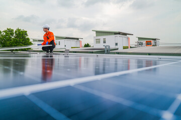 engineer man inspects construction of solar cell panel or photovoltaic cell by electronic device....
