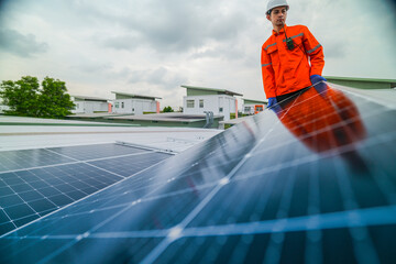 engineer man inspects construction of solar cell panel or photovoltaic cell by electronic device....