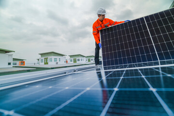 engineer man inspects construction of solar cell panel or photovoltaic cell by electronic device....