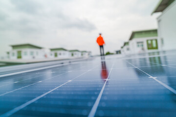 engineer man inspects construction of solar cell panel or photovoltaic cell by electronic device....