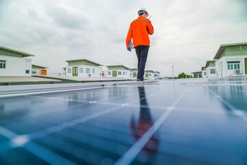engineer man inspects construction of solar cell panel or photovoltaic cell by electronic device....