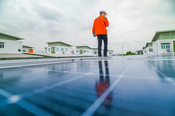 engineer man inspects construction of solar cell panel or photovoltaic cell by electronic device....