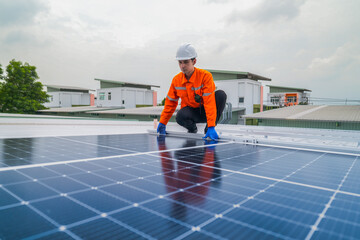 close up on grid of technology renewable solar energy. construction solar panels system on roof. Installing solar photovoltaic panel system. background of blue of solar cell system and structure roof.