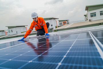 close up on grid of technology renewable solar energy. construction solar panels system on roof. Installing solar photovoltaic panel system. background of blue of solar cell system and structure roof.