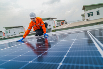 close up on grid of technology renewable solar energy. construction solar panels system on roof. Installing solar photovoltaic panel system. background of blue of solar cell system and structure roof.