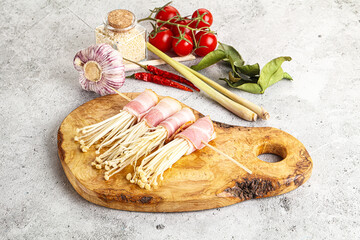 Raw Enoki mushroom with bacon