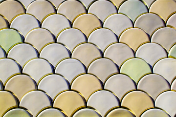 Abstract background of gold and silver circles, close-up photo.