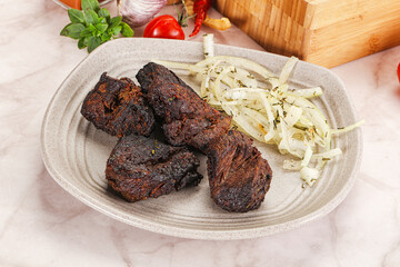 Grilled beef barbecue served onion