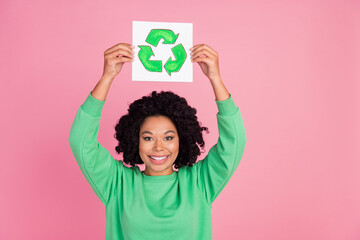 Portrait photo of wavy hair lady support green clean environment holding placard recycling garbage figure isolated on pink color background