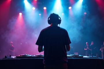 D.J. man standing in concert hall with smoke and colorful light enjoy music festival , generative AI