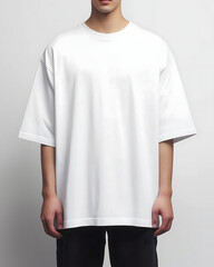 A plain white oversized T-shirt with a boxy cut and drop shoulders