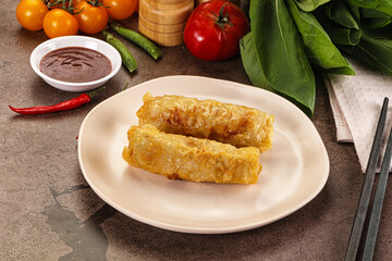 Vietnamese stuffed spring roll served sauce
