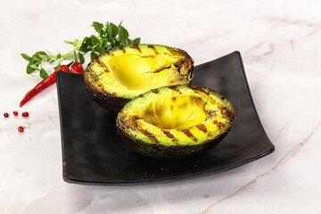 Sliced fresh avocado on the grill