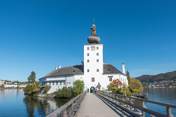 wooden footbridge to Schloss Ort caslte, lake Traunsee, Gmunden. blue sky