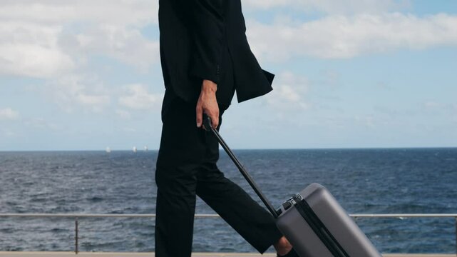 Tourist man with suitcase baggage in spain, A traveler with luggage suit jacket on business street go to a hotel, business office, airport terminal, enjoying the vibrant atmosphere