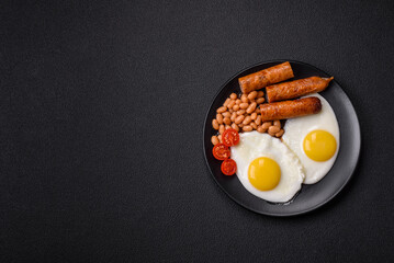 Full English breakfast with boiled eggs, beans, sausages, tomatoes
