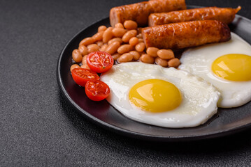 Full English breakfast with boiled eggs, beans, sausages, tomatoes