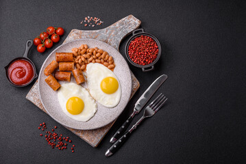 Full English breakfast with boiled eggs, beans, sausages, tomatoes