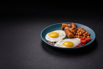Full English breakfast with boiled eggs, beans, sausages, tomatoes