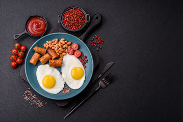 Full English breakfast with boiled eggs, beans, sausages, tomatoes