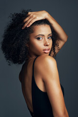 Naklejka premium Portrait, hair care and woman with beauty, aesthetic or dermatology on dark studio background. Face, person or model with wellness, grooming routine or texture with volume, cosmetics or healthy scalp