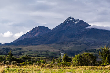 Ilinizas Volcano, Andean landscape with its crop fields and mountains showing their greenery on a...