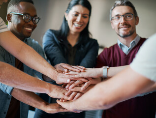 Employees, hands and pile in huddle for cooperation, teamwork and diversity in company mission....