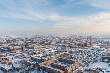 Obraz premium Scenic aerial view of the Old town of Klaipeda, Lithuania in golden evening light at winter. Klaipeda city port area and it's surroundings on chilly and snowy day.