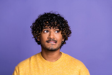 Obraz premium Photo of worried nervous man wear stylish yellow clothes look up empty space isolated on violet color background