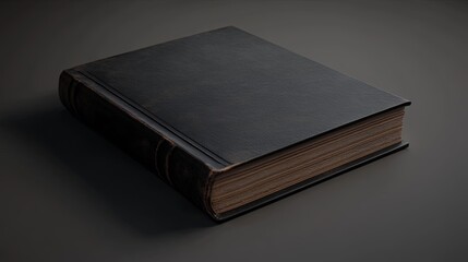 Obraz premium A closed, dark leather-bound book resting on a surface, suggesting a sense of mystery or knowledge.