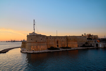 Aragonese castle of Taranto at sunset with orange colors in high definition