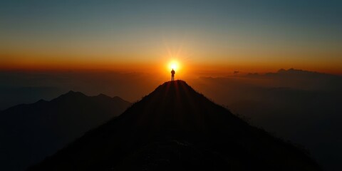 Silhouette of a Lone Adventurer at Sunrise on Mountain Peak