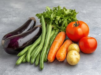 various vegetables, including carrots, tomatoes, green beans, and potatoes. Close-up of fresh vegetables on a grey background