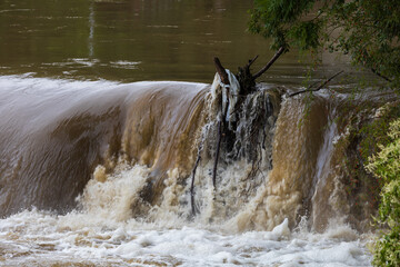 Weir on the Svitava River in the city of Brno, a local part of the Obrany. Big water after rain.