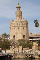 The torre del oro standing tall on the guadalquivir river in seville