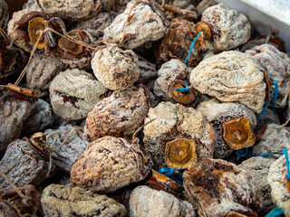 Fragment of a box with dried persimmon fruits