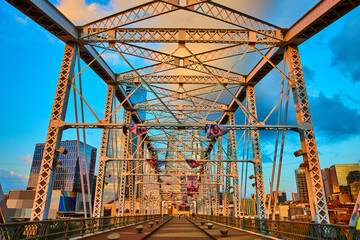 Nashville Pedestrian Bridge at Sunrise with Urban Skyline Perspective