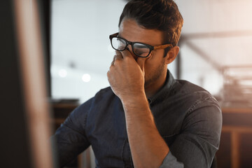 Man, stress and eye strain in office at night, computer glitch and deadline pressure for journalist. Male person, overwhelmed and anxiety for time management, 404 error and frustrated with mistake