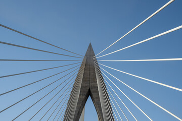 Detail of the Mohamed VI cable-stayed bridge over the Bouregreg river, or oued Bouregreg. Perfect blue sky.
