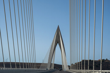 Detail of the Mohamed VI cable-stayed bridge over the Bouregreg river, or oued Bouregreg. Perfect blue sky.