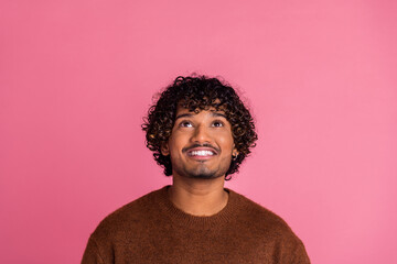 Photo of funny positive nice man wear stylish brown clothes look up empty space isolated on pink color background