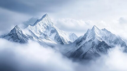 breathtaking panorama of snowcapped mountains shrouded in misty clouds jagged peaks pierce the sky creating a dramatic winter landscape that evokes a sense of awe and serenity