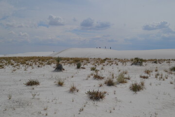 People are walking on a dunes in the White Sands National Park, New Mexico